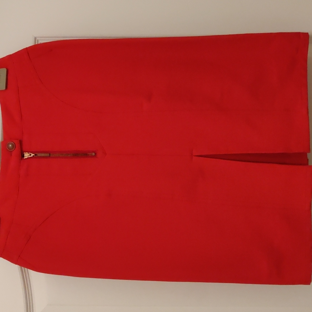 Brand new red skirt. Front zipper. Pleated in the front. Sleat in the back